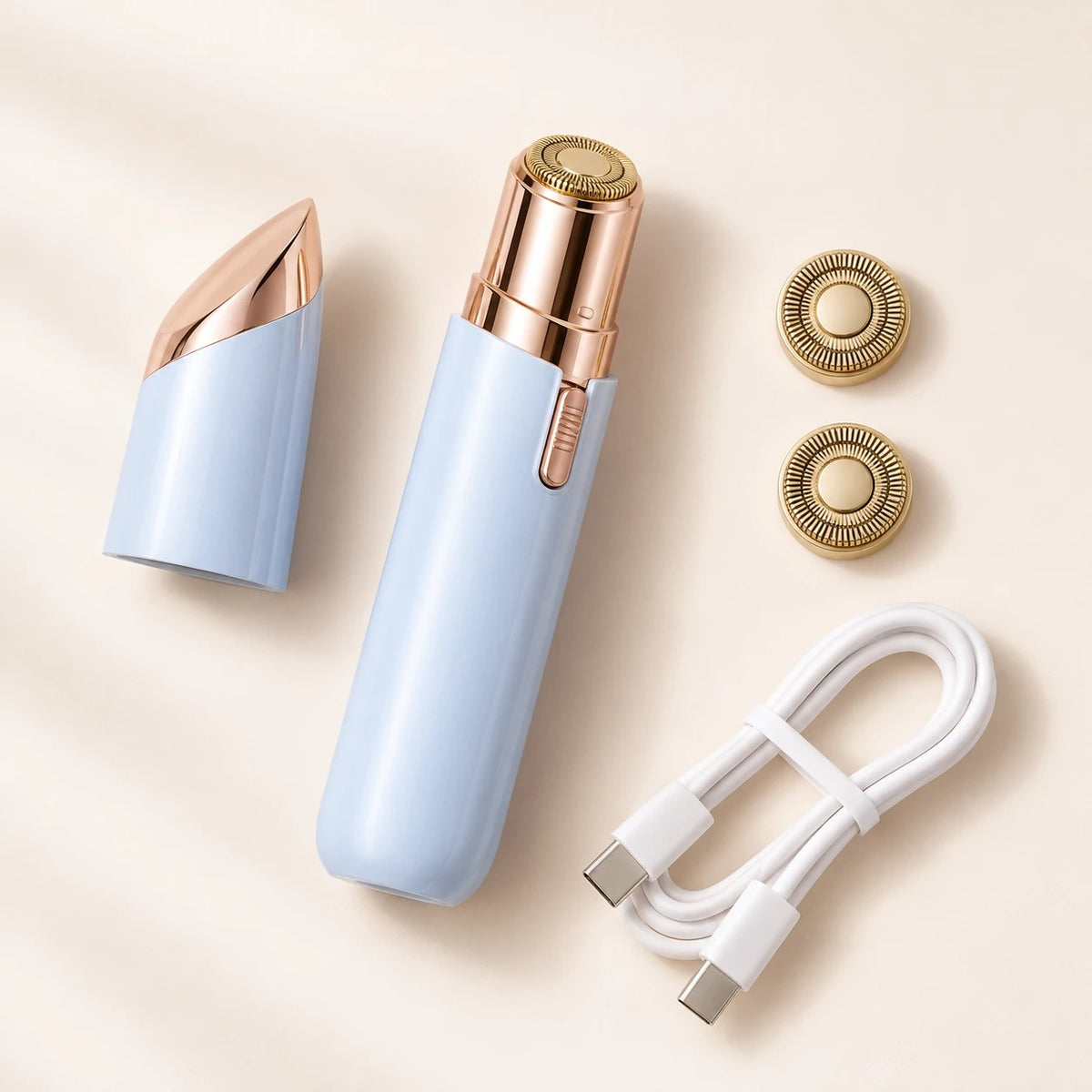 Depiladora facial azul con tapa, dos cabezales de recambio y cable USB-C