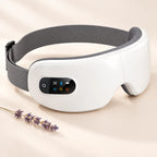 Gafas de masaje para ojos blancas con cinta gris y una rama de lavanda